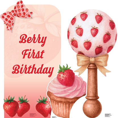 Decorations for a berry-themed first birthday party with a lollipop, cupcake, and bow.