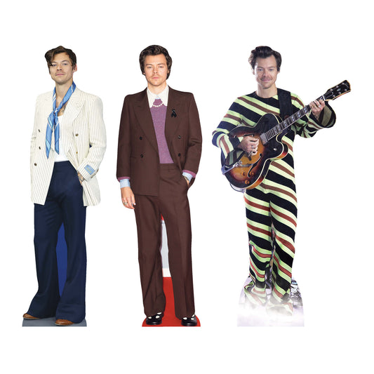 Three cardboard cutouts of Harry Styles in different outfits, suitable for shelf top display.