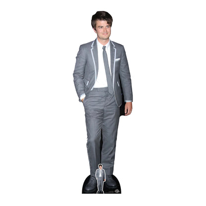 A cardboard cutout of an actor wearing a grey suit, promoting the Netflix series 'Stranger Things'.